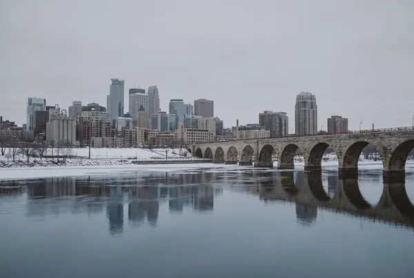 The Minneapolis skyline seen across the Mississippi river on an overcast winter morning
